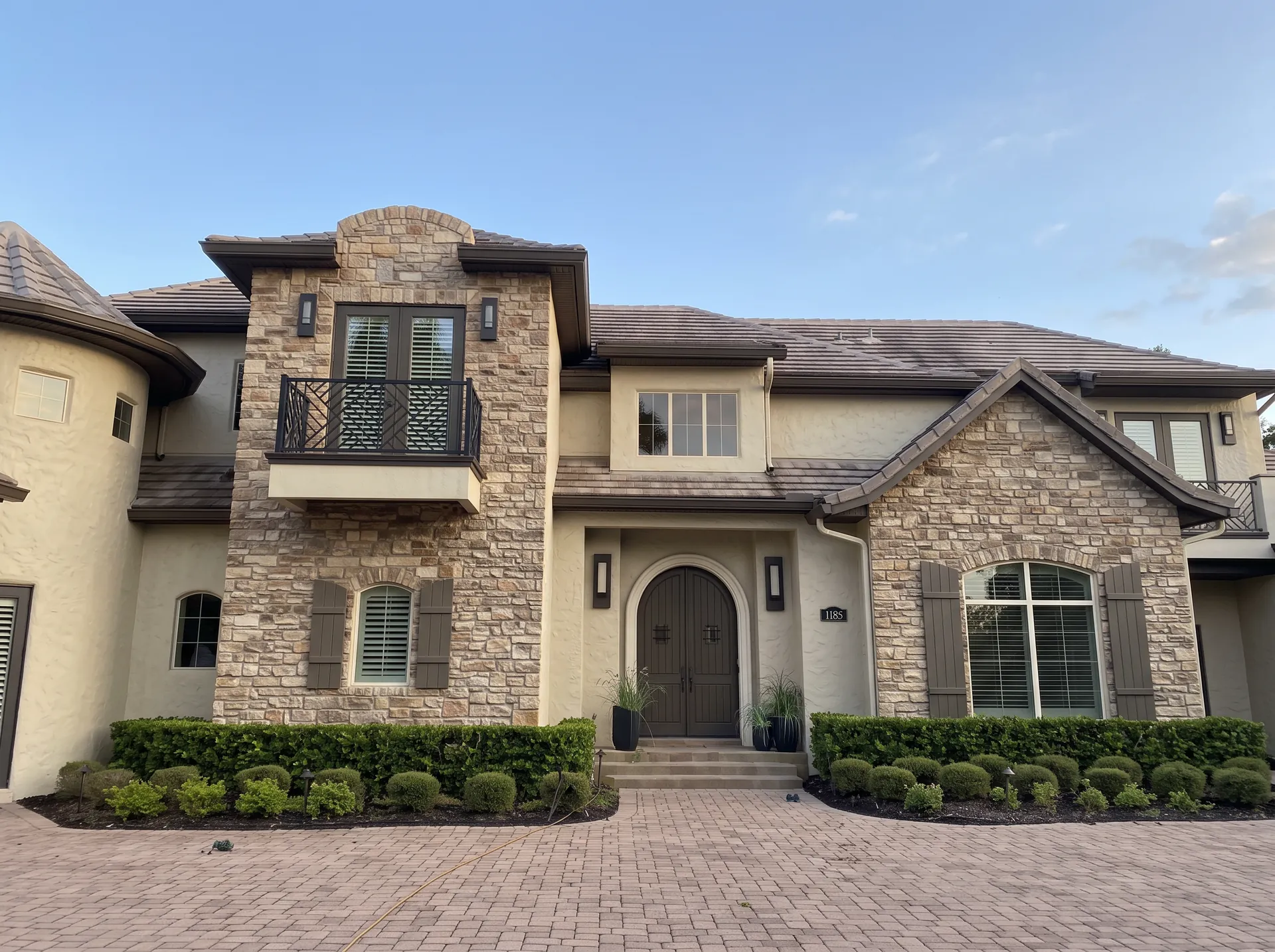 Stone home before Christmas light installation